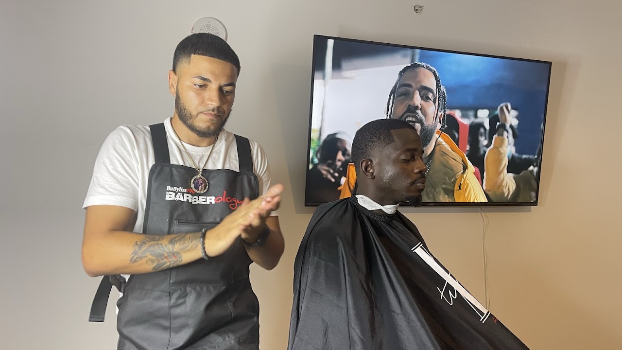 High-end professional photography of a master barber performing a precision fade
